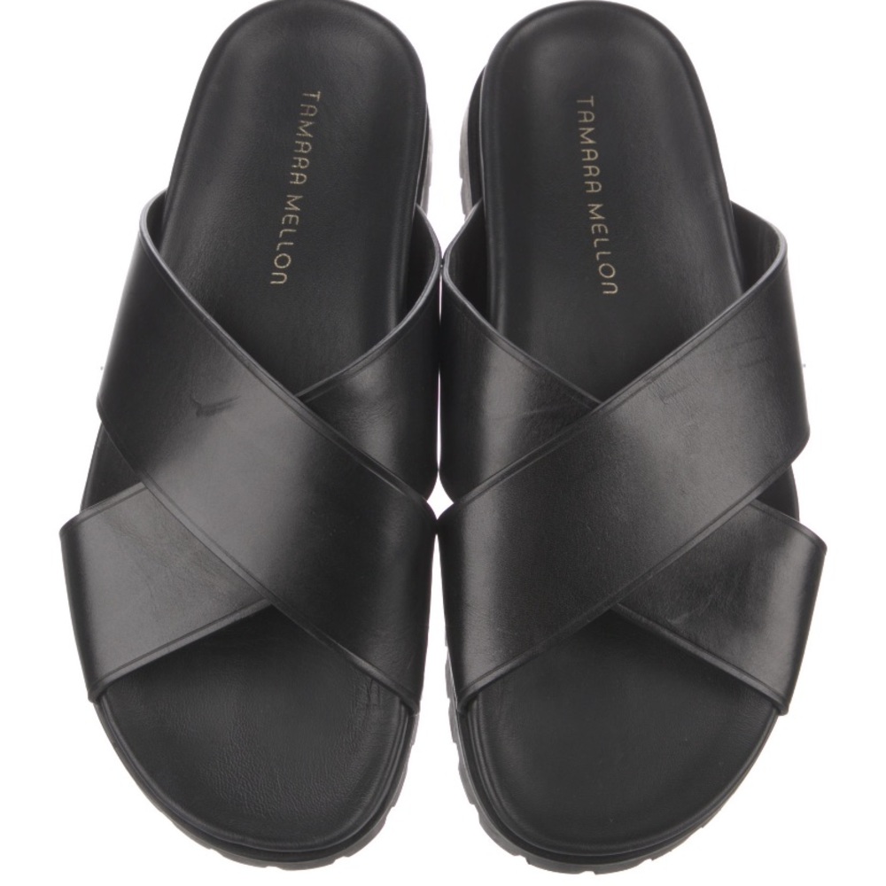 Tamara Mellon black leather slides.